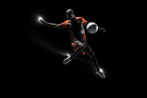 soccer-player-in-mid-air-kicking-ball-on-a-black-background-ai-generated-photo.jpeg