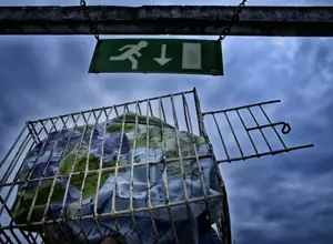 a globe photographed against the light inside a cage, an iron cage, a globe photographed against the light inside a cage, an iron cage,