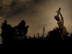 A statue photographed against the light in a bar in Gattinara, Italy