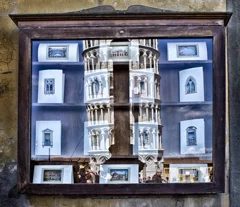 Piazza dei Miracoli in Pisa: in a shop, I photographed the reflection of the Leaning Tower of Pisa; the Leaning Tower of Pisa reflected amongst the postcards,
