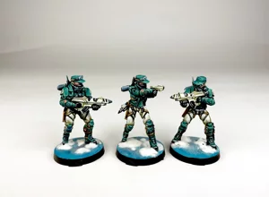 Group of three Varuna Division infantry miniatures, professionally painted in teal and white with snow bases. Group of three Varuna Division infantry miniatures, professionally painted in teal and white with snow bases.