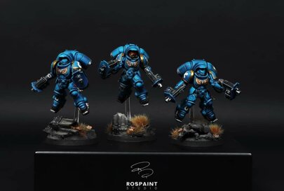 warhammer 40k painting commission ultramarines hellblasters squad space marines heavy support professional miniature painting service high quality display level osl plasma weapon glow custom painted miniatures rospaint studio best miniature painter worldwide shipping