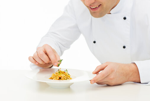 cooking-profession-haute-cuisine-food-people-concept-close-up-happy-male-chef-cook-decorating-dish.jpeg