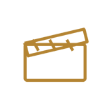 Icona dorata di un ciak cinematografico per i film di matrimonio