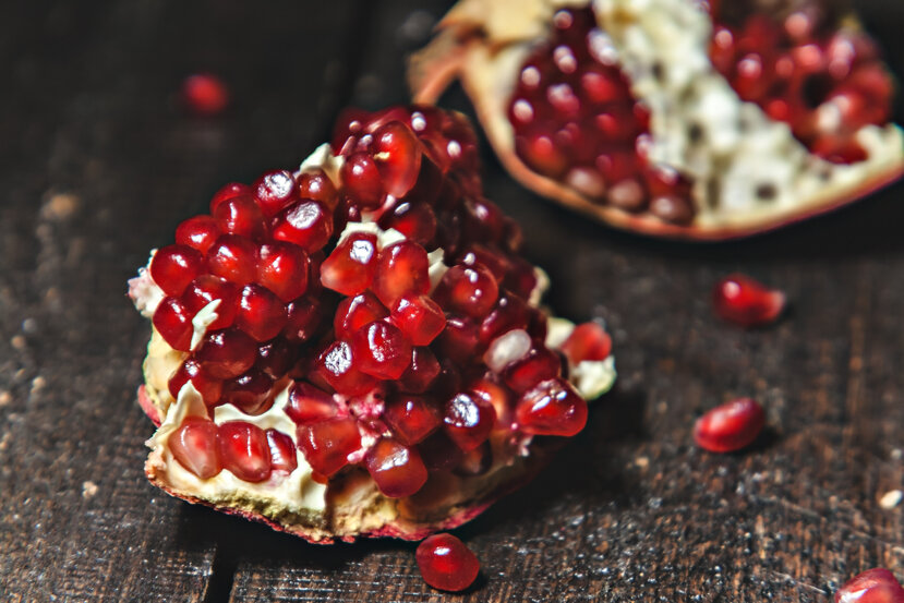 broken-pomegranate-closeup-dark-background.jpeg