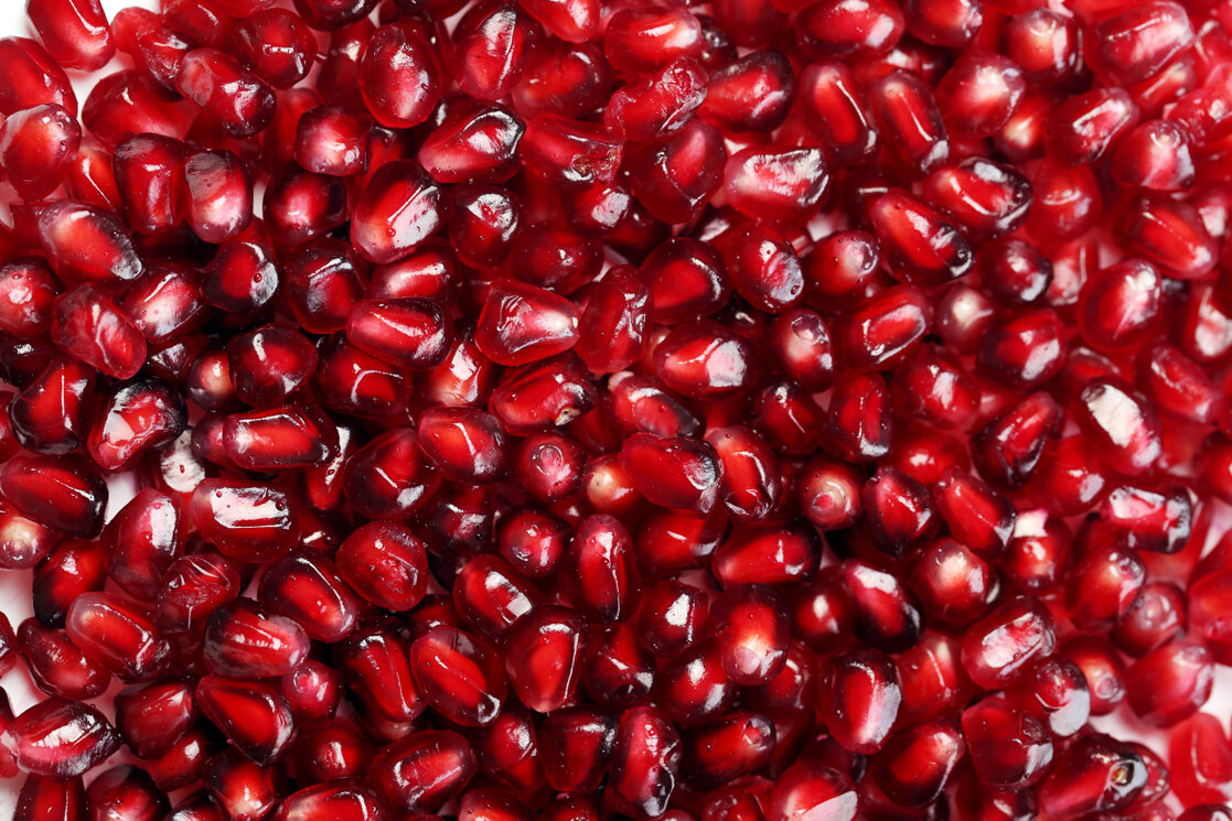 exotic-delicious-pomegranate-white-background.jpeg