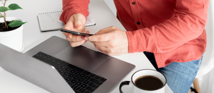 businessman-working-with-laptop-remotely-communicating-social-network-sitting-home