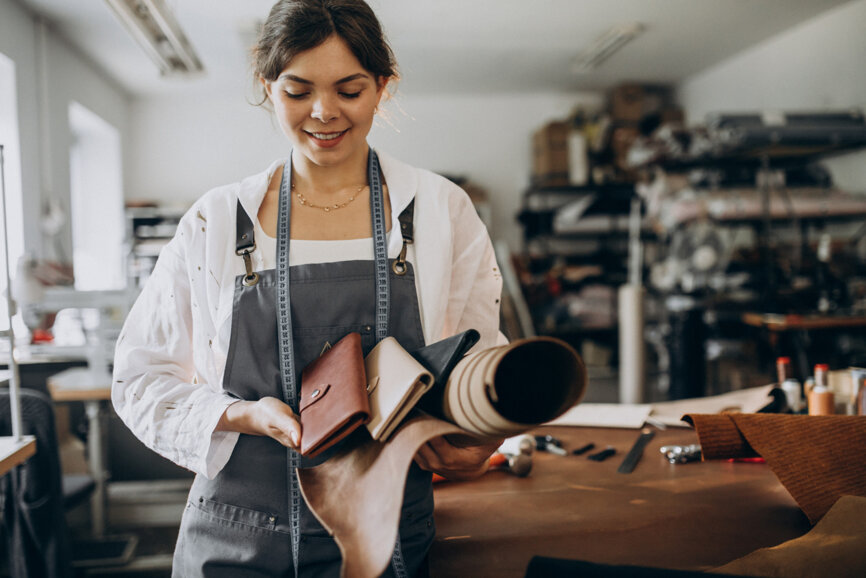 woman-tailor-working-on-leather-fabric (1).jpeg