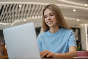 woman-freelancer-using-laptop-watching-training-courses-online-working-at-home-successful-blogger-live-streaming