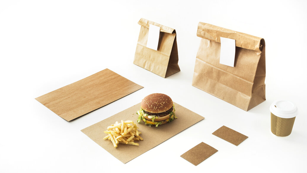 burger-french-fries-paper-with-disposable-drink-paper-package-white-backdrop.jpeg