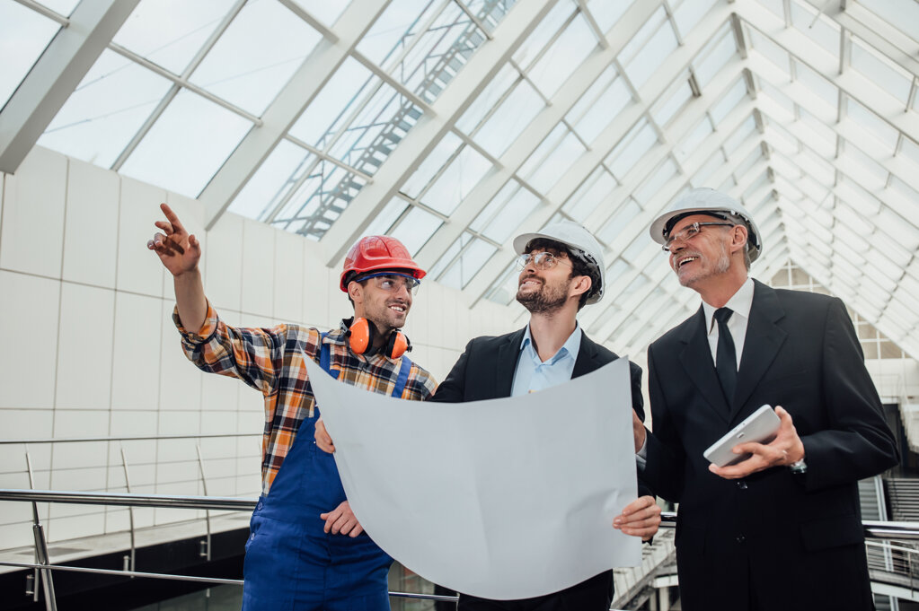 portrait-two-successful-architects-foreman-discussing-design-project.jpeg