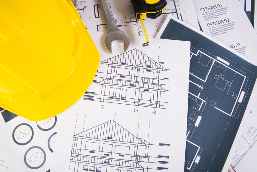 engineer-workplace-with-blueprints-protractor-safety-helmet.jpeg engineer-workplace-with-blueprints-protractor-safety-helmet.jpeg