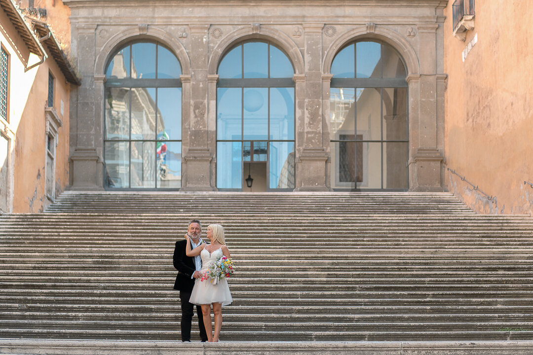 299---cheryl--marcus-----mgl03472.jpeg An emotional moment in Rome's Campidoglio after a civil wedding, photographed by Italian photographer Maria Giulia La Rosa