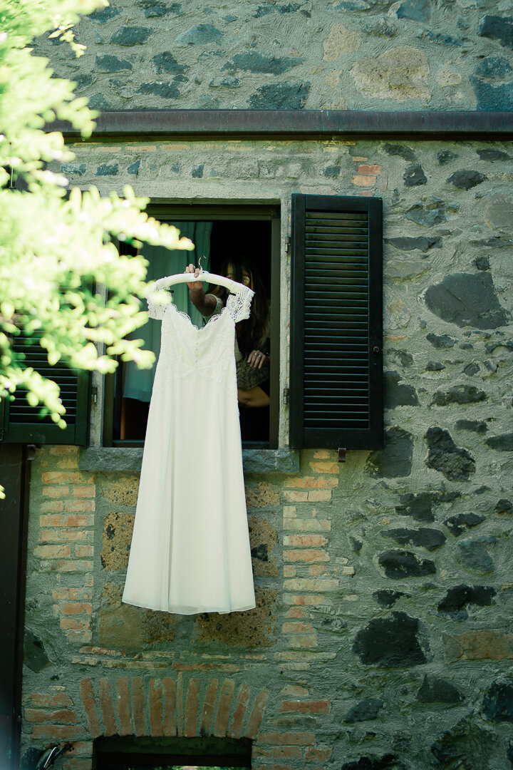 umbria-wedding-photographer-locanda-rosati-orvieto---2025---02.jpeg Lace wedding dress waiting to be photographed at a destination wedding in Umbria