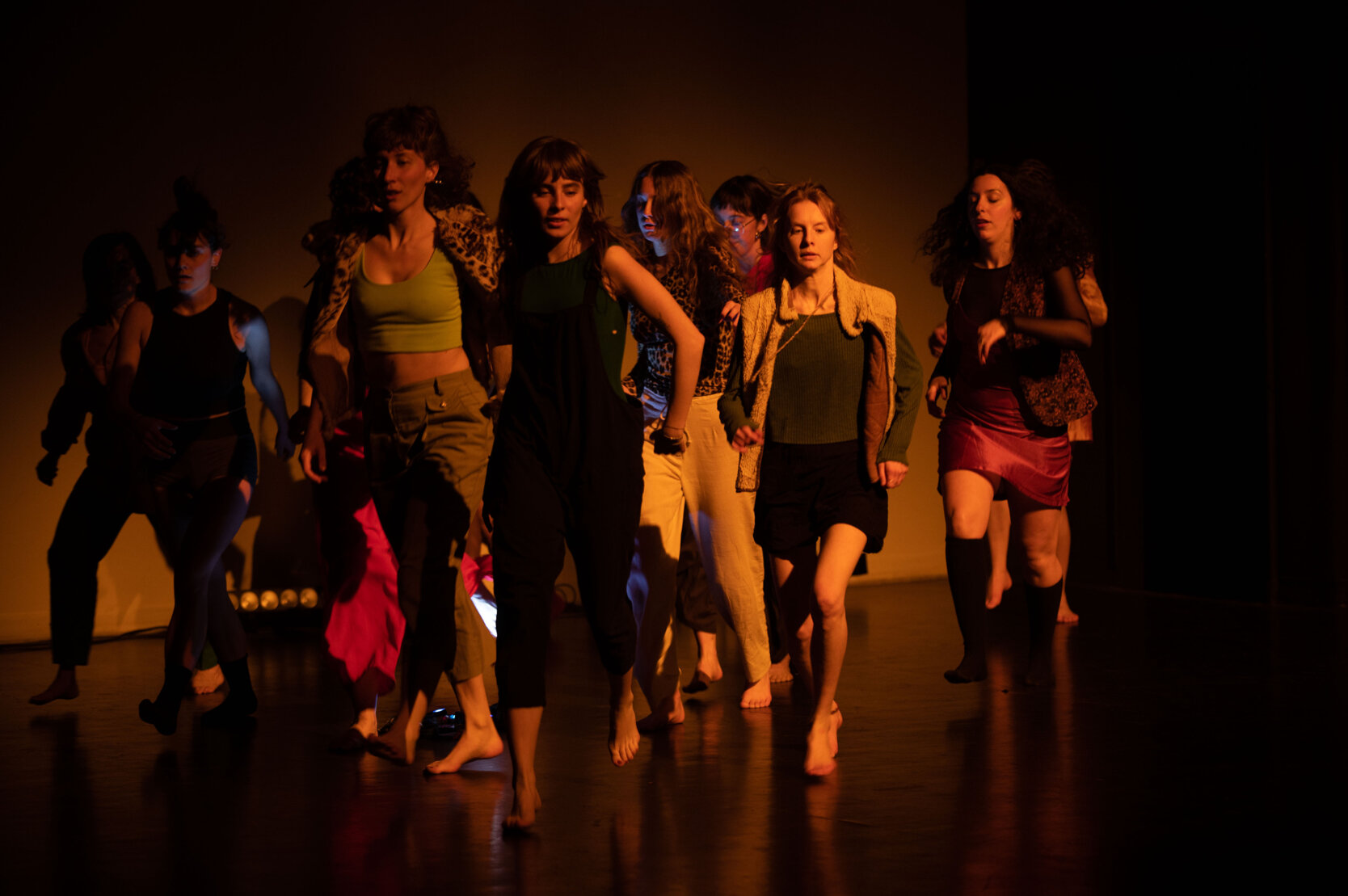 Dancers walking forward together in a contemporary performance