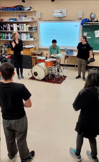 Participants exploring rhythm and movement during a creative workshop