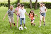 children-playing-football-outside_23-2148210529.jpeg