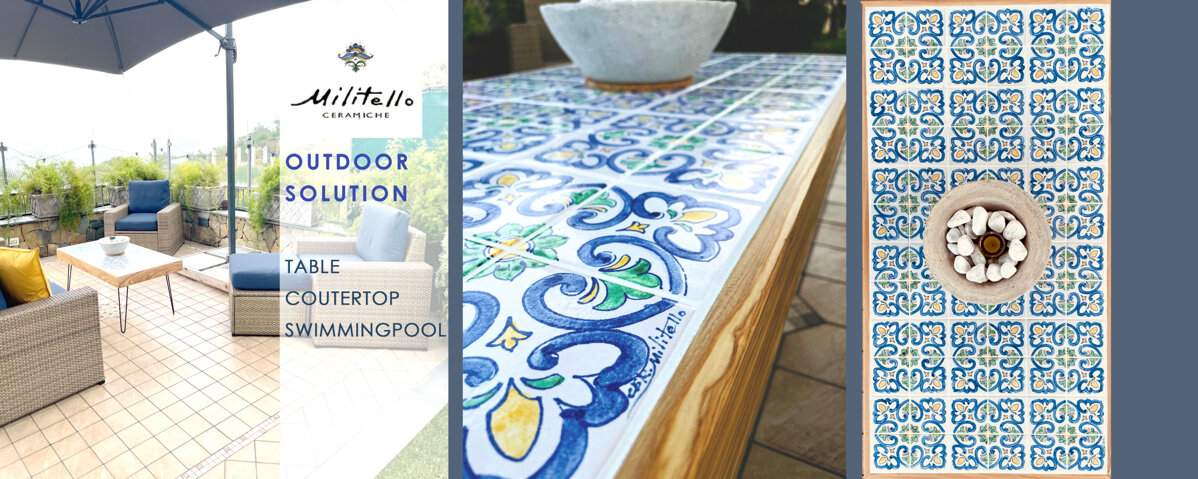 Outdoor area with Sicilian tiles and handcrafted ceramics table, Mediterranean design.