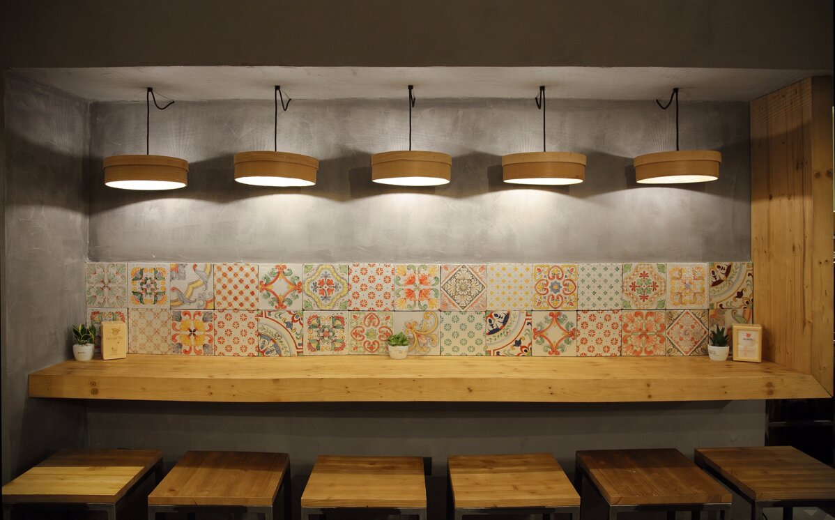 Interior design with Sicilian tiles and handcrafted ceramics in Mediterranean style.