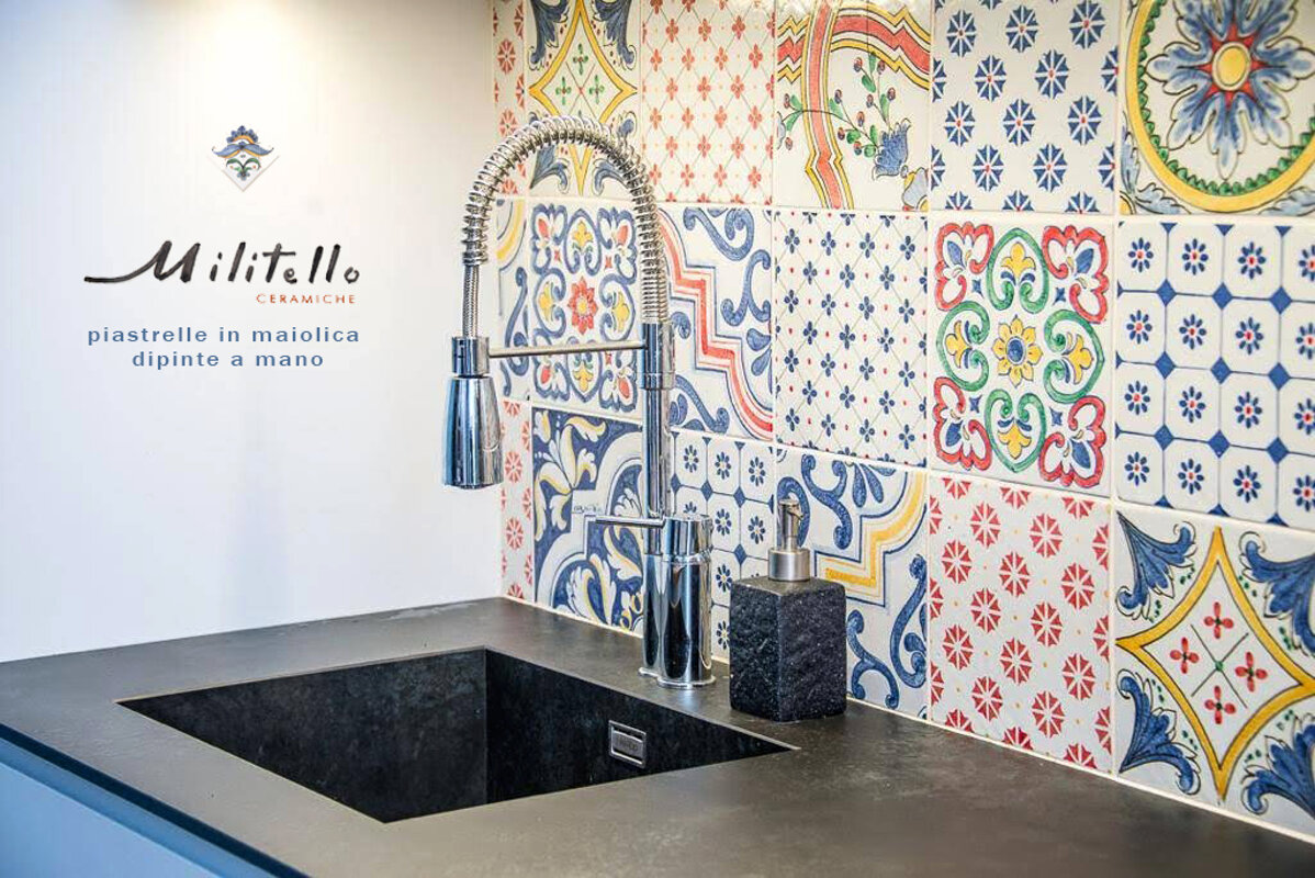 Sicilian handcrafted ceramic tiles in a kitchen setting with colorful Mediterranean design.