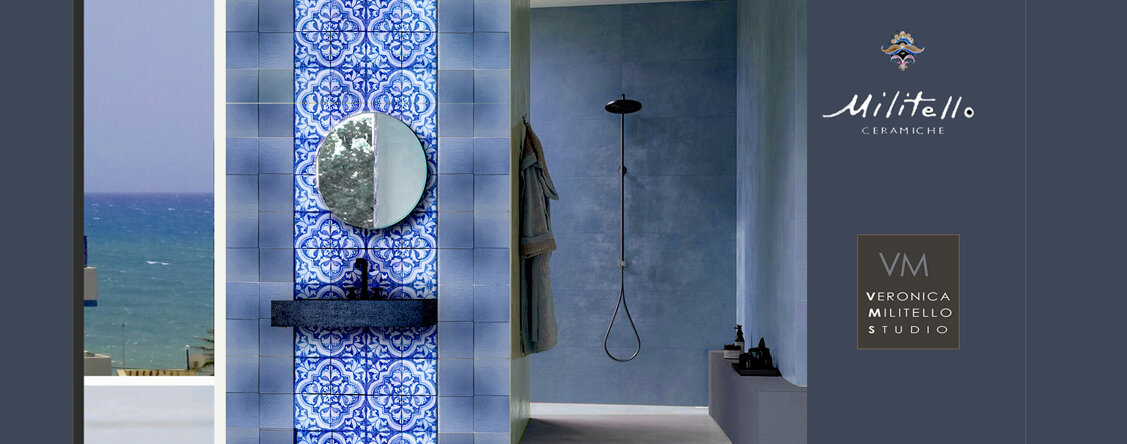 Bagno con piastrelle siciliane e maiolica dipinta a mano, design artigianale.