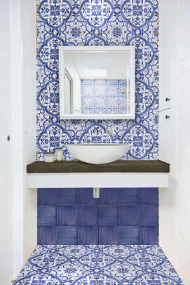 Bathroom with blue Sicilian tiles, featuring handcrafted Mediterranean design.