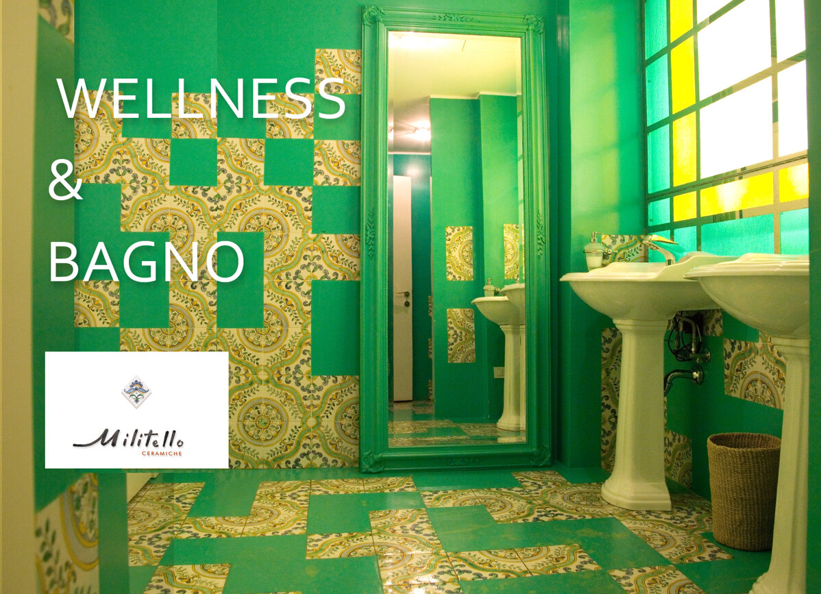 Bathroom with Sicilian tiles and green accents featuring handcrafted ceramic design.