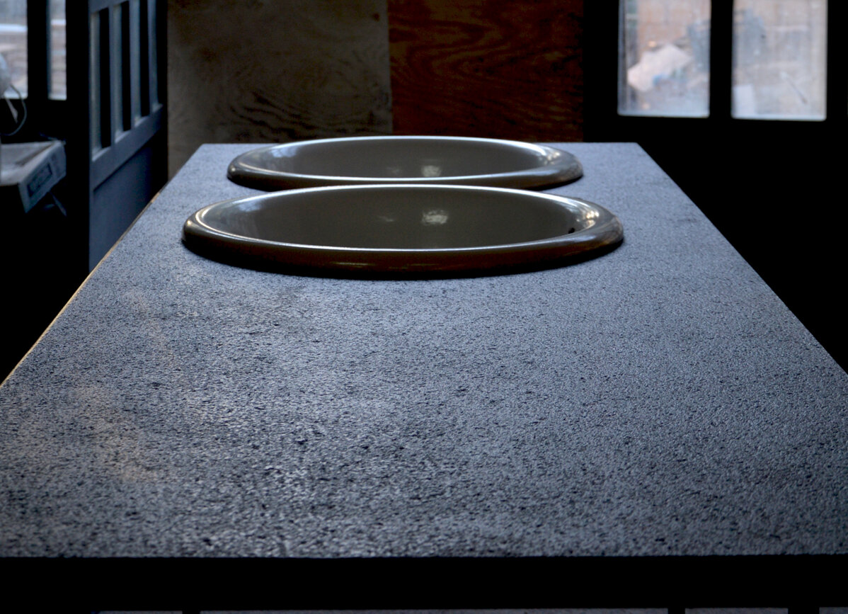 Modern kitchen countertop with two built-in sinks.