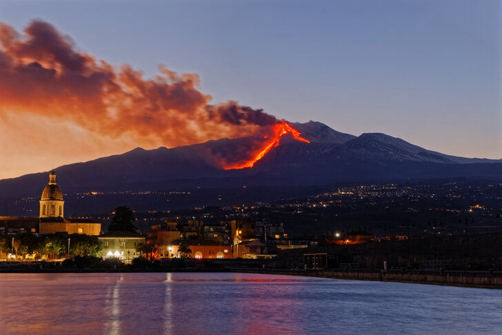 illuminated-buildings-city-etna-eruption.jpeg