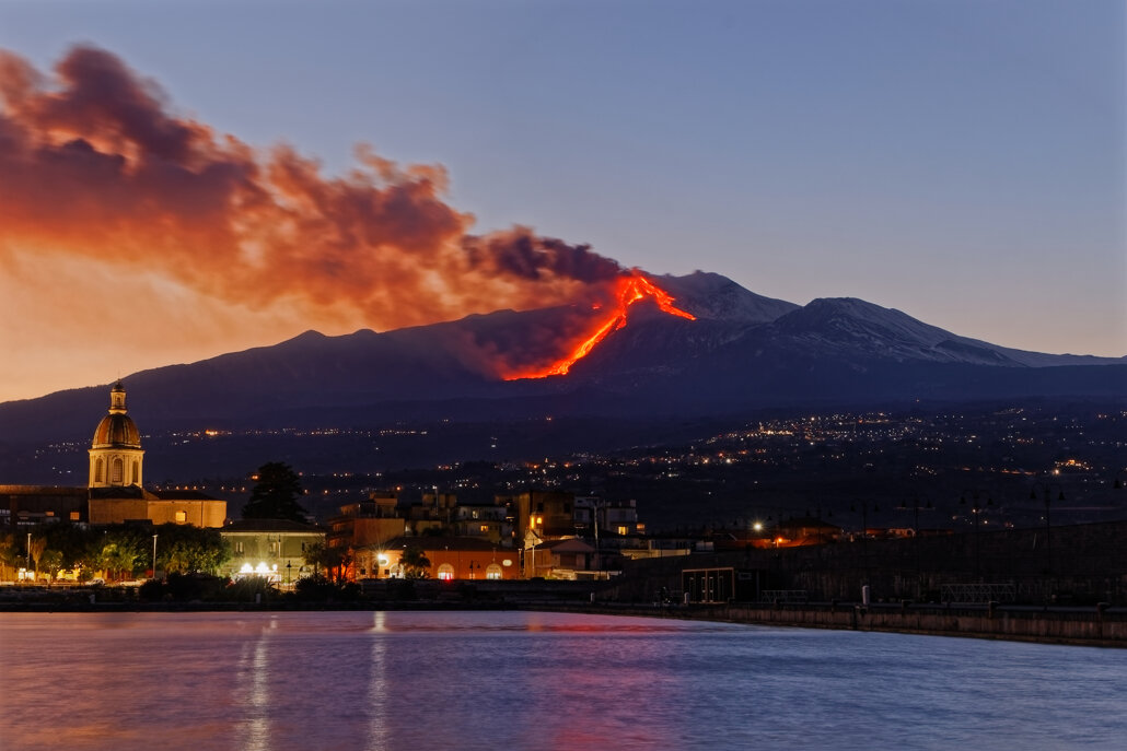 illuminated-buildings-city-etna-eruption.jpeg