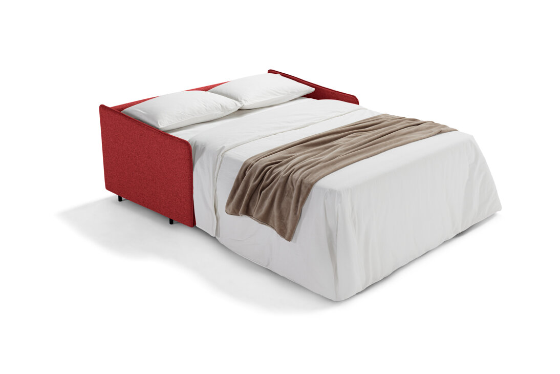 Red artisan sofa bed with white sheets and beige throw blanket, available at online furniture store with free shipping.