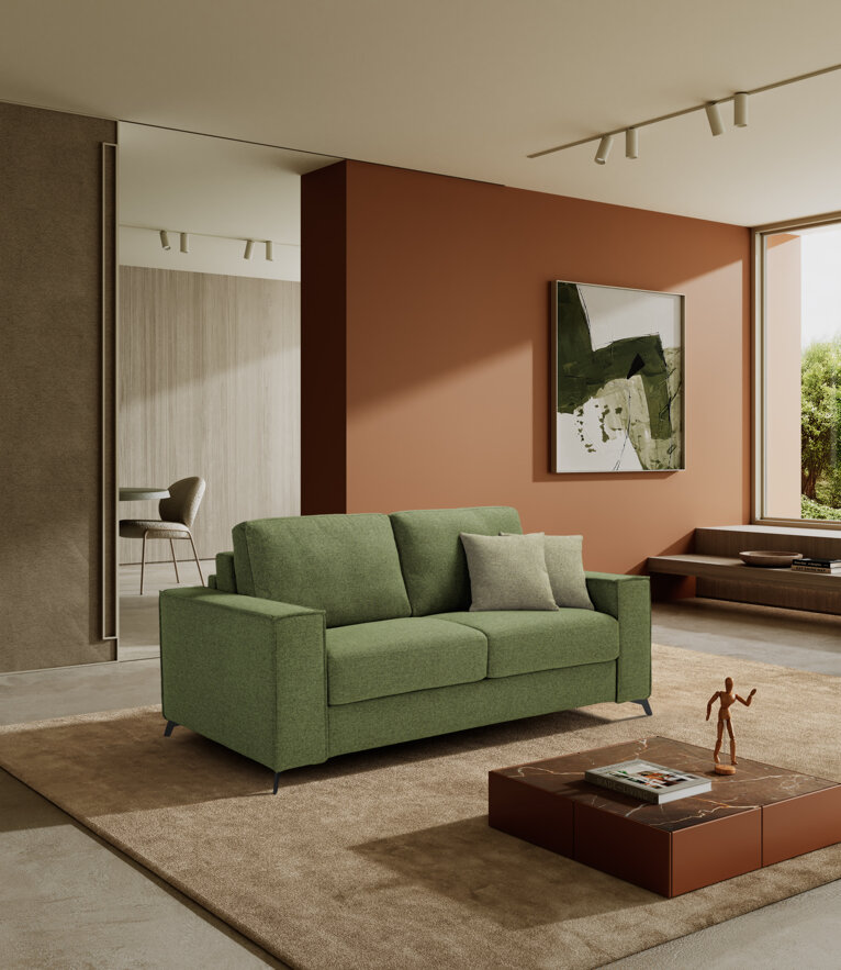 Modern living room with a green artisan sofa bed and abstract art on the wall