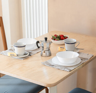 Cozy breakfast setup with coffee and strawberries at Honey Apartment Cozy breakfast setup with coffee and strawberries at Honey Apartment