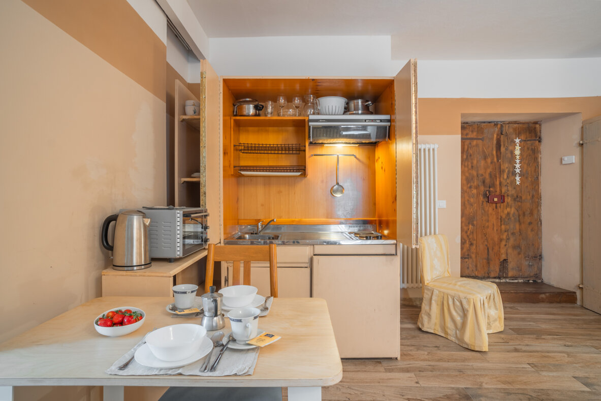 Cozy kitchen with dining area in Honey Apartment for comfortable stay Cozy kitchen with dining area in Honey Apartment for comfortable stay