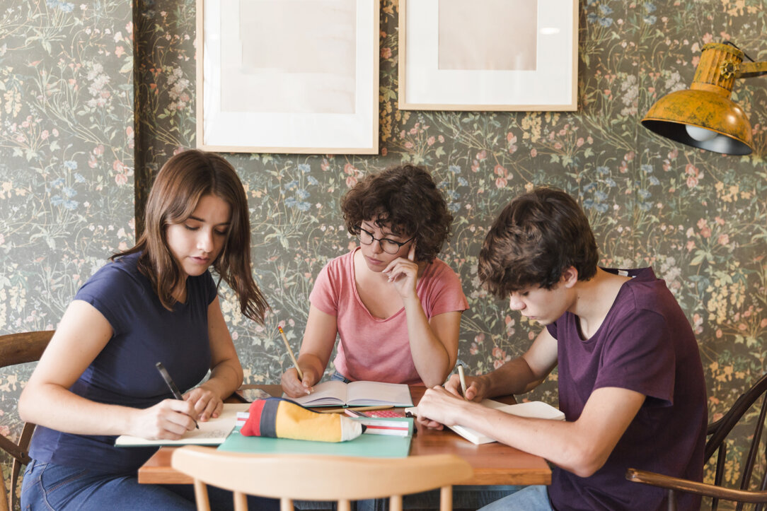 teenagers-doing-homework-cafe.jpeg