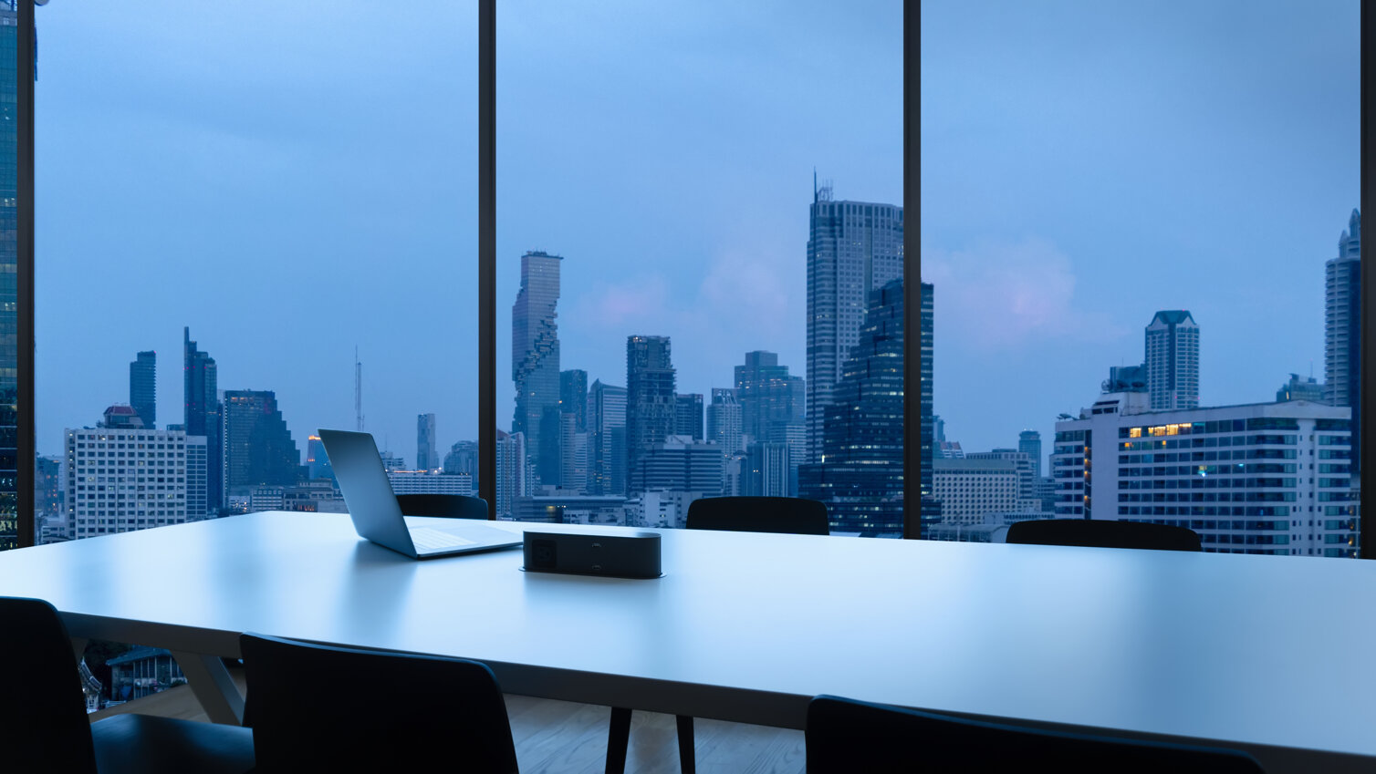 meeting-room-workplace-with-notebook-laptop-comfortable-work-table-office-windows-bangkok-city-view.jpeg