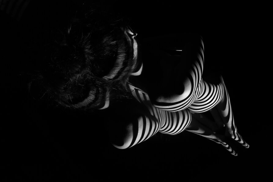 nude-woman-with-black-white-zebra-stripes.jpeg