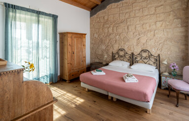 Cozy organic farmhouse bedroom with balcony view, Carlentini, Sicily vacation