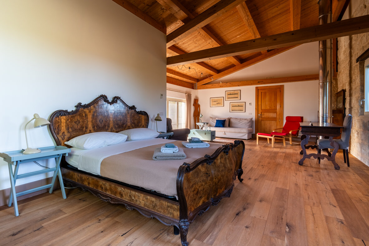 Loft room with elegant wooden furniture and peaceful atmosphere in Sicily farmhouse. Loft room with elegant wooden furniture and peaceful atmosphere in Sicily farmhouse.