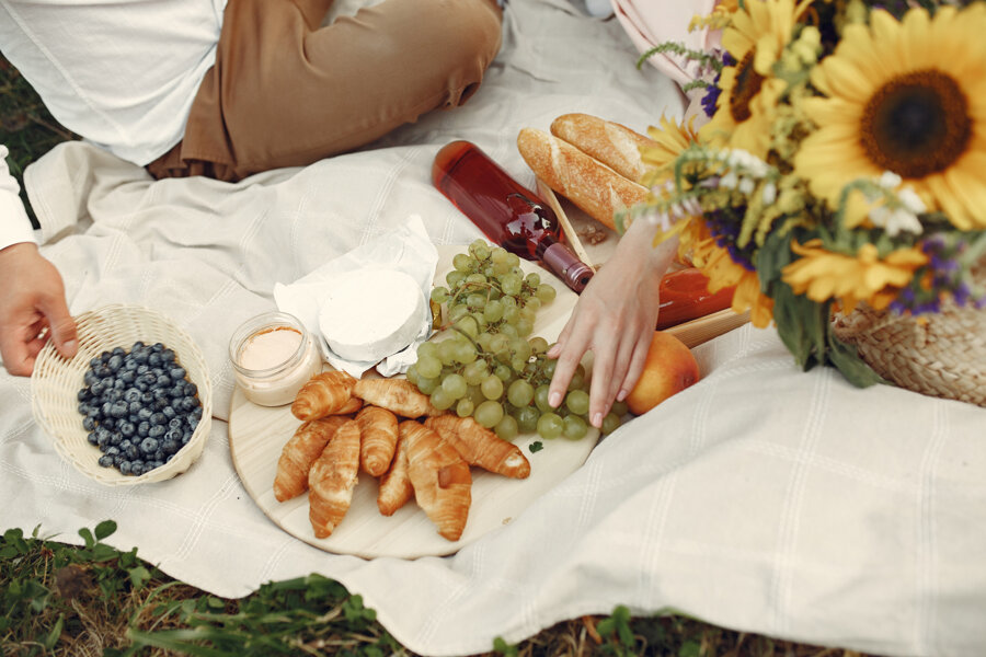 couple-field-brunette-white-dress-pair-sitting-grass.jpeg