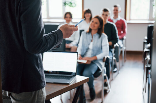everyone-is-smiling-listens-group-people-business-conference-modern-classroom-.jpeg