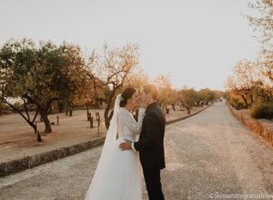 Couple embracing on rustic path at sunset, Sicily weddings, luxury destination weddings, unique love stories