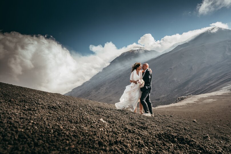 Luxury wedding couple embracing on Mount Etna in Sicily