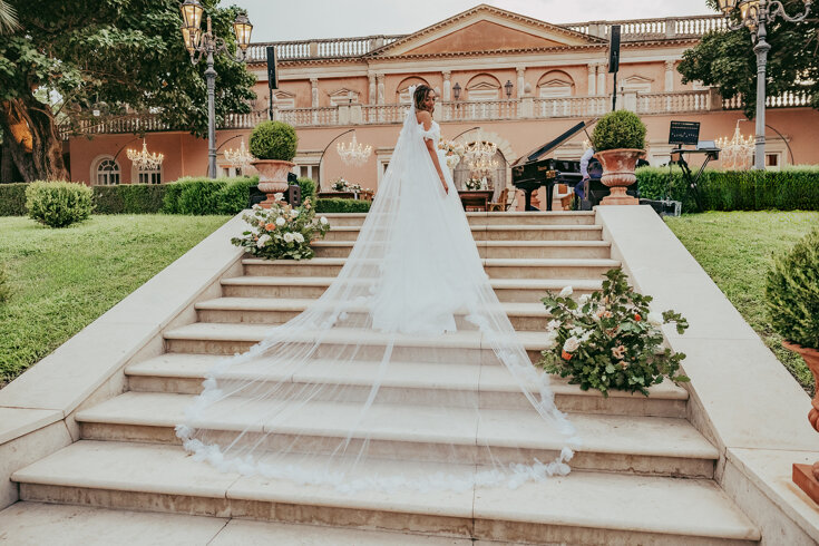 Luxury Sicilian wedding with bride on elegant staircase in beautiful garden setting