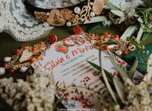 Luxurious wedding invitation with elegant jewelry and floral decorations