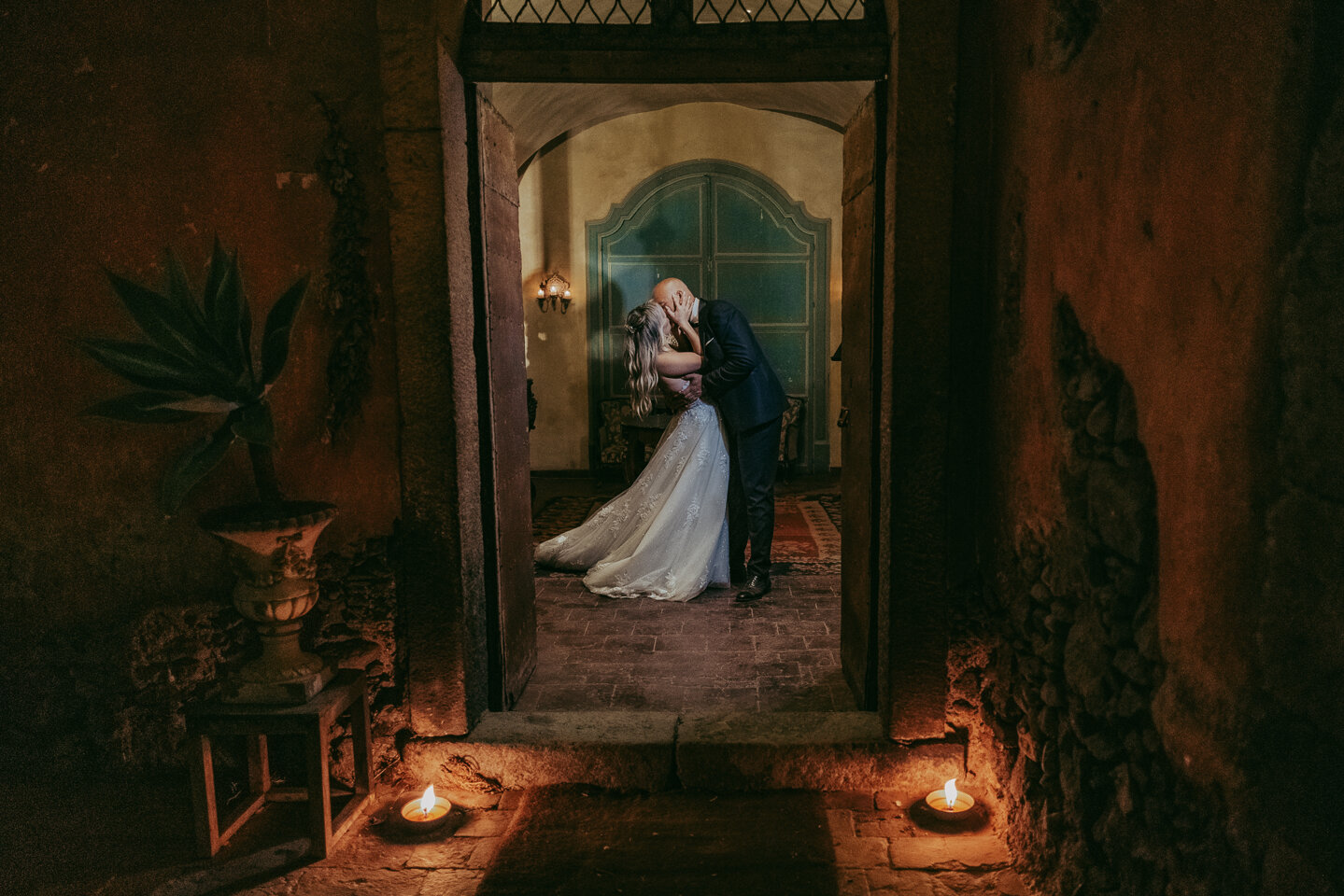 Luxury destination wedding in Sicily, couple kissing in romantic setting