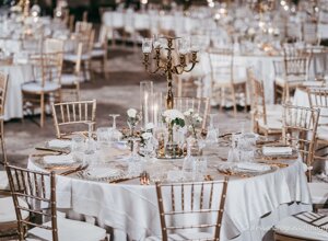 Elegant wedding reception table setting with candelabra and floral decorations