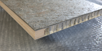 door covered in stone with aluminum honeycomb support