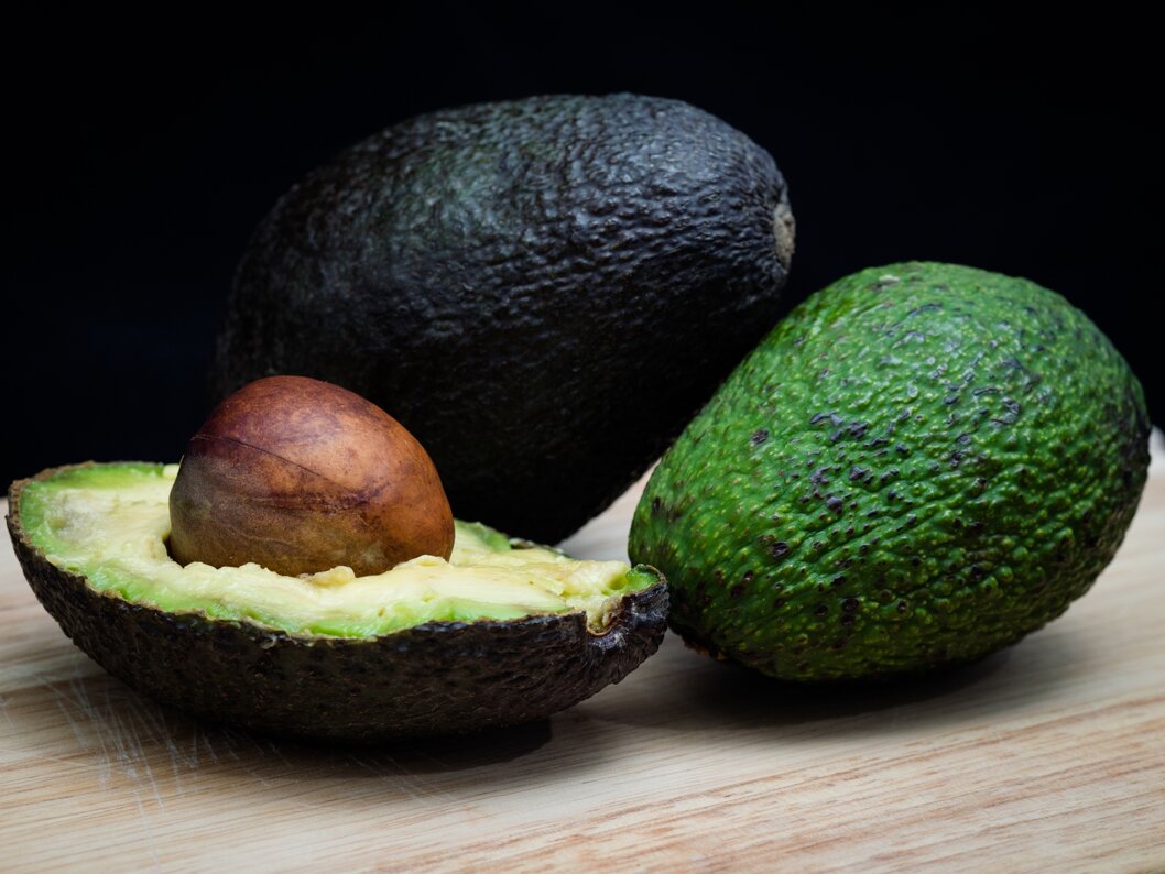 closeup-shot-avocados-cutting-board.jpeg