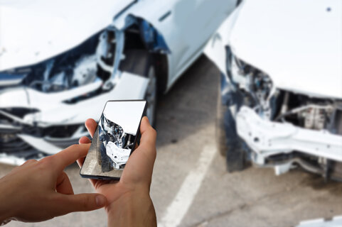 man-photographing-his-vehicle-with-damages-accident-insurance-with-smart-phone.jpeg